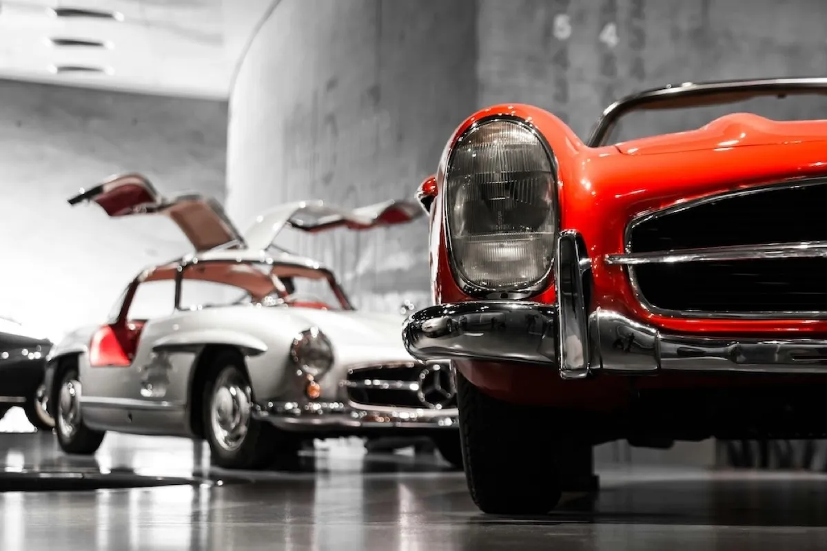 A collection of classic and luxury vehicles in a private garage